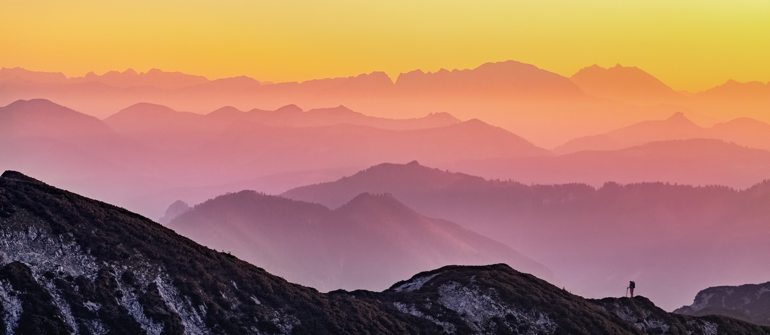Background image of mountains at dawn
